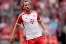 Kane - after his first hat-trick: Taking the ball from him and collecting the signatures of other Bayern players