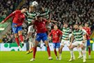 Celtic played to a high-scoring draw with Atletico Madrid, gaining the first point