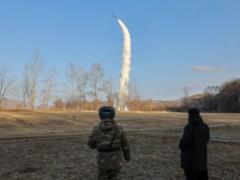 North Korea launches strategic cruise missiles and promises tough stance towards US