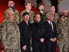 Bono appeared at the Cannes Festival with the military Armed Forces