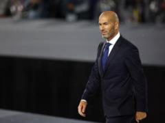 Zidan pulled on his sweatshirt and turned to the trainer s robot