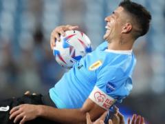 Luis Suarez shocked the football world by pressing on the back of the national team of Uruguay