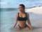 Tanned Kim Kardashian in mini-bikini published photos from the rest
