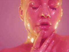 Naked Aguilera felt for her breasts, dripped gel and licked it in a new video