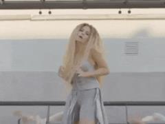 Long-haired blonde Nastya Kamensky danced at the bus stop in a new music video